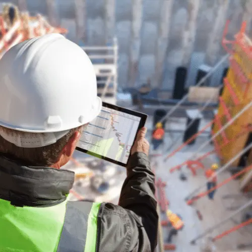 construction worker using equipment dealer crm