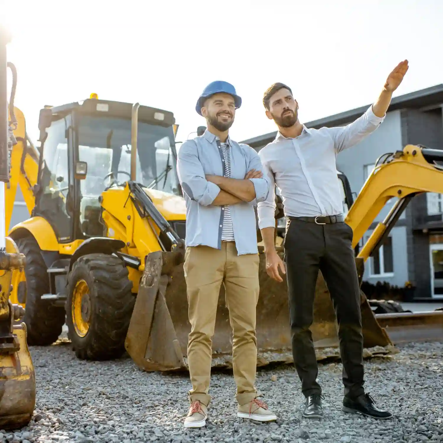 This image shows two men discussing on a construction site